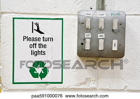 Sign reminding to turn off lights posted beside light switches View Large Photo Image Stock Photograph - Sign reminding to turn off lights posted beside light switches. Fotosearch