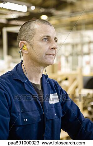 Textile worker concentrating on task in carpet tile factory View Large Photo Image Stock Image - Textile worker concentrating on task in carpet tile factory. Fotosearch