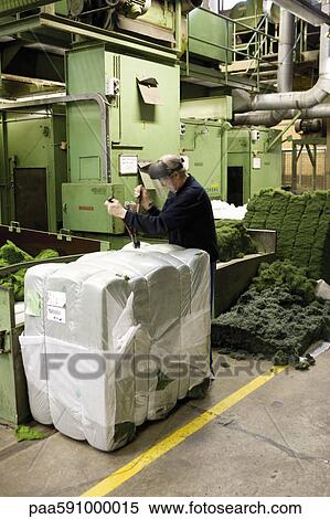 Textile worker unpacking materials in carpet tile factory View Large Photo Image Stock Photography - Textile worker unpacking materials in carpet tile factory. Fotosearch