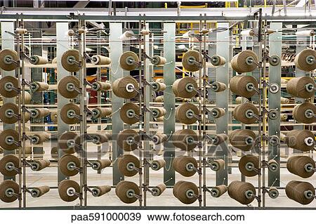 Yarn spools on carpet weaving machine View Large Photo Image Stock Photo - Yarn spools on carpet weaving machine. Fotosearch
