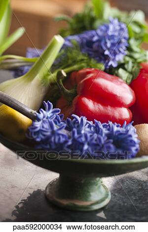 Picture - Assorted vegetables and fruits with freshly cut hyacinth. Fotosearch