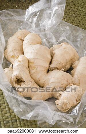 Stock Image - Fresh ginger root. Fotosearch