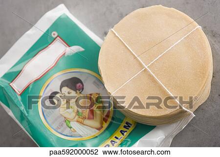 Fresh package of uncooked papadum View Large Photo Image Stock Image - Fresh package of uncooked papadum. Fotosearch