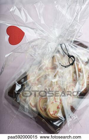 Stock Photography - Heart-shaped cookies packaged for Valentine's Day. Fotosearch