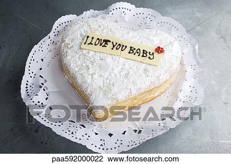 Heart-shaped pastry with lettering on decorative white chocolate reading, "I love you baby" View Large Photo Image Stock Image - Heart-shaped pastry with lettering on decorative white chocolate reading, "I love you baby". Fotosearch