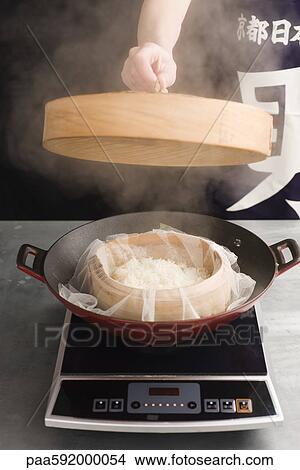 Steaming glutinous rice View Large Photo Image Picture - Steaming glutinous rice. Fotosearch