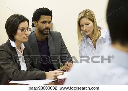 Stock Image - Executives in meeting. Fotosearch