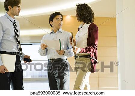 Executives talking in corridor View Large Photo Image Stock Photography - Executives talking in corridor. Fotosearch