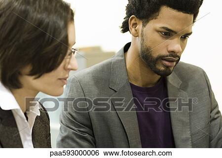 Executives working together View Large Photo Image Stock Photograph - Executives working together. Fotosearch