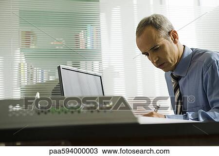 Businessman working in office View Large Photo Image Stock Image - Businessman working in office. Fotosearch
