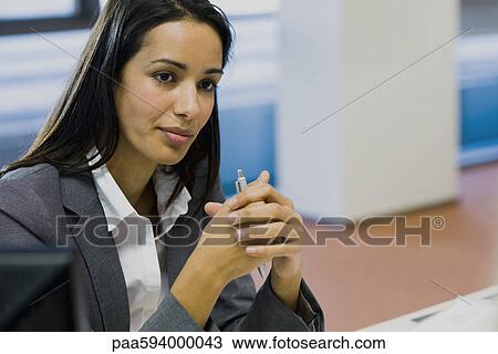 Businesswoman looking away in thought, portrait View Large Photo Image Stock Image - Businesswoman looking away in thought, portrait. Fotosearch