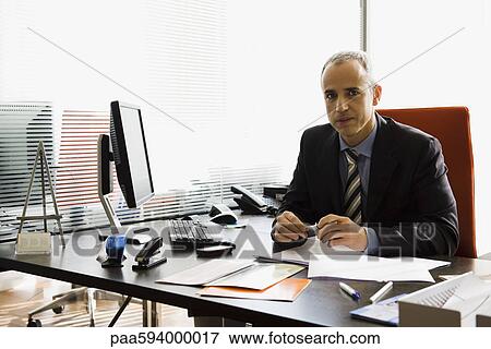 Executive in office, portrait View Large Photo Image Stock Photo - Executive in office, portrait. Fotosearch