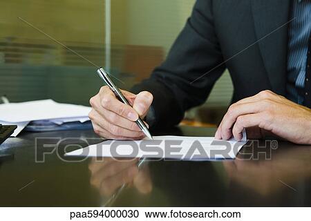 Executive signing paperwork, cropped View Large Photo Image Stock Image - Executive signing paperwork, cropped. Fotosearch