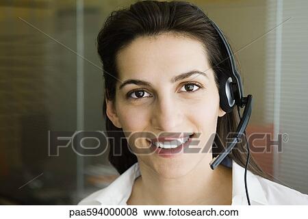 Woman wearing telephone headset, portrait View Large Photo Image Stock Photo - Woman wearing telephone headset, portrait. Fotosearch
