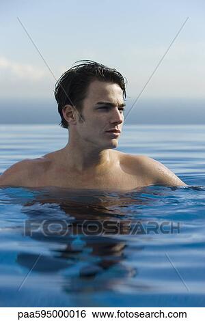 Stock Photograph - Man swimming, portrait. Fotosearch