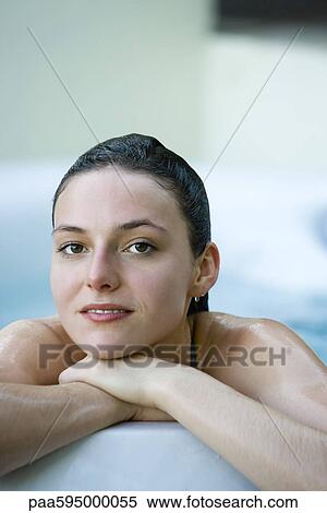 Stock Photography - Woman relaxing in bathtub, portrait. Fotosearch