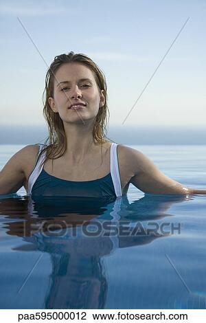 Woman relaxing in water, portrait View Large Photo Image Stock Image - Woman relaxing in water, portrait. Fotosearch