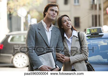 Couple arm in arm outdoors View Large Photo Image Picture - Couple arm in arm outdoors. Fotosearch