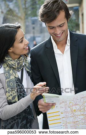 Couple consulting map outdoors View Large Photo Image Stock Image - Couple consulting map outdoors. Fotosearch