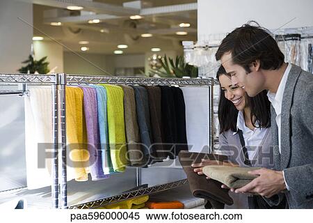 Couple shopping for bath towels View Large Photo Image Stock Photography - Couple shopping for bath towels. Fotosearch