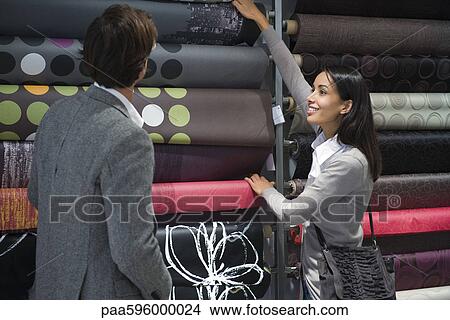 Couple shopping for fabric View Large Photo Image Picture - Couple shopping for fabric. Fotosearch