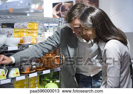 Stock Image - Couple shopping together. Fotosearch