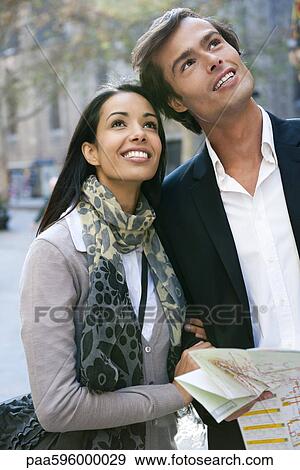 Couple sightseeing together View Large Photo Image Stock Photo - Couple sightseeing together. Fotosearch