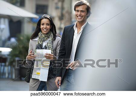 Couple walking together outdoors, portrait View Large Photo Image Stock Photo - Couple walking together outdoors, portrait. Fotosearch