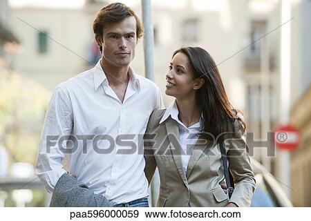 Couple walking together outdoors View Large Photo Image Stock Photo - Couple walking together outdoors. Fotosearch