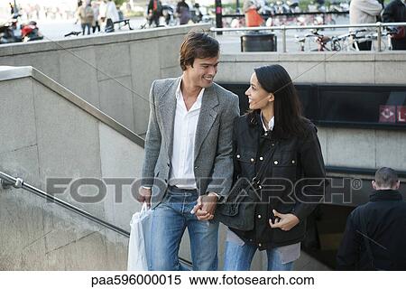 Couple walking up stairs, holding hands View Large Photo Image Stock Photography - Couple walking up stairs, holding hands. Fotosearch