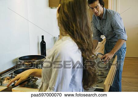 Couple cooking together View Large Photo Image Stock Image - Couple cooking together. Fotosearch