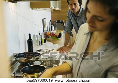 Couple cooking together View Large Photo Image Stock Photo - Couple cooking together. Fotosearch