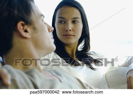 Couple looking into each other's eyes View Large Photo Image Stock Image - Couple looking into each other's eyes. Fotosearch