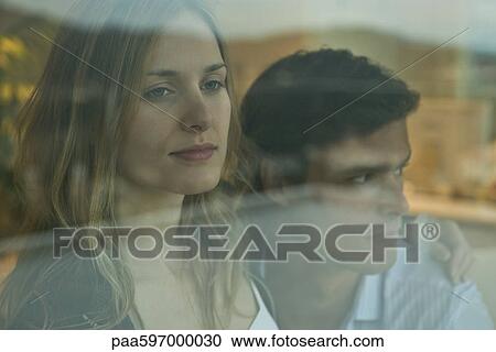 Couple looking through window, portrait View Large Photo Image Stock Image - Couple looking through window, portrait. Fotosearch