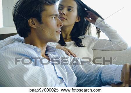Couple relaxing together View Large Photo Image Stock Photography - Couple relaxing together. Fotosearch