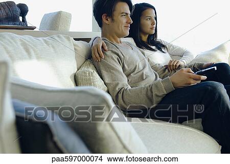 Couple watching TV together View Large Photo Image Picture - Couple watching TV together. Fotosearch