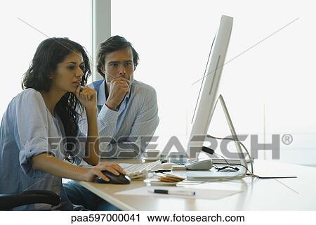 Couple working on computer at home View Large Photo Image Stock Image - Couple working on computer at home. Fotosearch