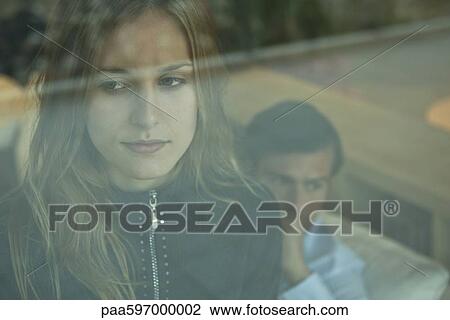 Woman looking through window, portrait View Large Photo Image Stock Image - Woman looking through window, portrait. Fotosearch