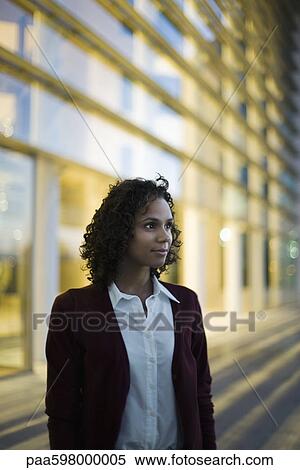 Stock Photography - Businesswoman looking away in thought, portrait. Fotosearch