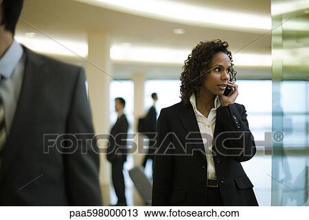 Businesswoman talking on cell phone View Large Photo Image Stock Image - Businesswoman talking on cell phone. Fotosearch
