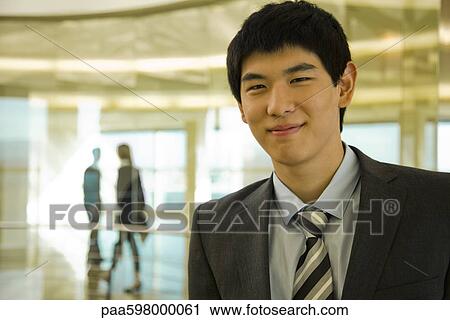 Young businessman, portrait View Large Photo Image Stock Image - Young businessman, portrait. Fotosearch