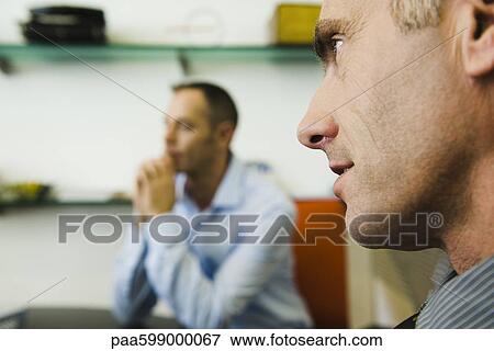 Businessman, profile, man in background View Large Photo Image Stock Photo - Businessman, profile, man in background. Fotosearch