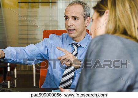 Businessman talking to client View Large Photo Image Stock Photograph - Businessman talking to client. Fotosearch