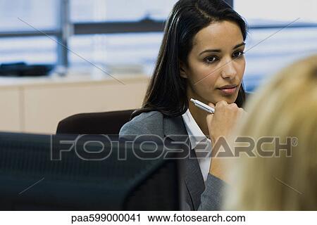 Businesswoman in meeting View Large Photo Image Stock Image - Businesswoman in meeting. Fotosearch