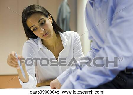 Businesswoman working with colleague View Large Photo Image Stock Photography - Businesswoman working with colleague. Fotosearch