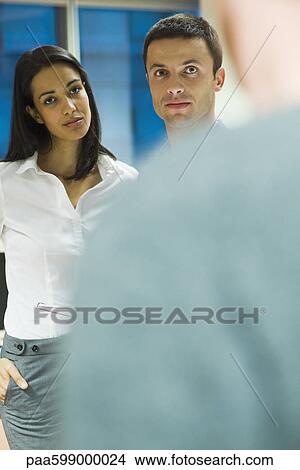 Colleagues talking in office View Large Photo Image Picture - Colleagues talking in office. Fotosearch