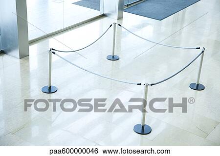 Stock Photograph - Roped off area in lobby. Fotosearch