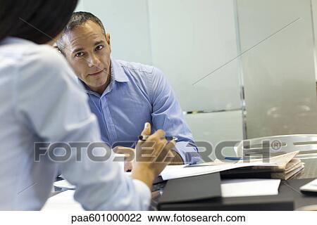 Businessman working with colleague View Large Photo Image Stock Image - Businessman working with colleague. Fotosearch