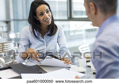 Businesswoman talking to colleague View Large Photo Image Stock Image - Businesswoman talking to colleague. Fotosearch