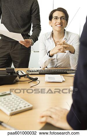 Businesswoman working in office View Large Photo Image Stock Image - Businesswoman working in office. Fotosearch